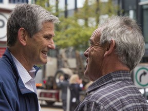 Liberal leader Andrew Wilkinson, seen here talking to a logging truck driver during a forestry policy protest, sense an opening and is prepared to take on the NDP over the forest industry crisis.