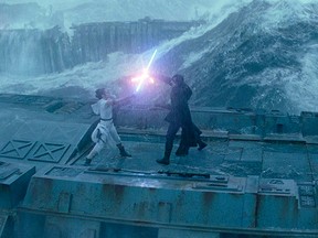 Rey (Daisy Ridley) fights Kylo Ken (Adam Driver) in a lightsaber duel in "Star Wars: The Rise of Skywalker."