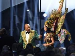 Steve Harvey interviews Miss Malaysia Shweta Sekhon at the 2019 Miss Universe Pageant at Tyler Perry Studios on Dec. 8, 2019 in Atlanta, Ga. (Paras Griffin/Getty Images)