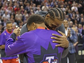 Former Raptors MVP Kawhi Leonard accepts his NBA championship ring from former teammate Kyle Lowry in Toronto on Wednesday December 11, 2019.