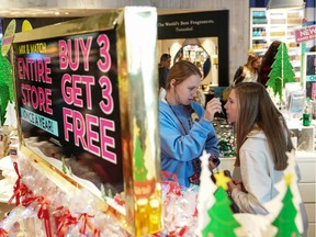 Girls smell products in Bath and Body Works in King of Prussia mall, one of the largest retail malls in the U.S.