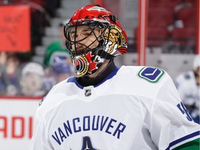 OTTAWA, ON - JANUARY 2:  Mike McKenna #56 of the Vancouver Canucks looks on during warmups prior to a game against his former team the Ottawa Senators, from which he was traded earlier in the day at Canadian Tire Centre on January 2, 2019 in Ottawa, Ontario, Canada.