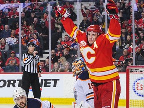 Matthew Tkachuk (19) of the Calgary Flames celebrates after teammate Elias Lindholm scored against Mikko Koskinen of the Edmonton Oilers at Scotiabank Saddledome on Jan. 11, 2020 in Calgary, Alberta, Canada.