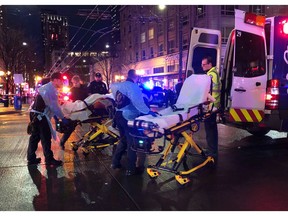 SEATTLE - EMT and Police give first aid to a shooting victim in downtown on January 22, 2020 in Seattle, Washington.
