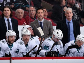 Bench bosses, left to right, Mike Ricci, head coach Bob Boughner and Roy Sommer of the San Jose Sharks watch from the bench during the third period of their NHL game against the Arizona Coyotes on Jan. 14 in Glendale, Ariz. The Coyotes defeated the Sharks 6-3.