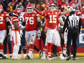 Chiefs' Laurent Duvernay-Tardif, No. 76, looks on as quarterback Patrick Mahomes celebrates after defeating the Titans on Sunday to advance to the Super Bowl.