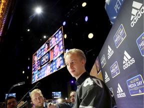 Elias Pettersson of the Vancouver Canucks speaks to reporters during Thursday's Media Day for the 2020 NHL All-Star Game at Stifel Theatre in St Louis, Miss.  Jacob Markstrom and Quinn Hughes, also of the Canucks, are taking part in the event, too.