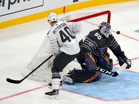 Goaltender Jordan Binnington #50 of the St. Louis Blues defends the goal against Elias Pettersson #40 of the Vancouver Canucks in the game between Pacific Division and Central Division during the 2020 Honda NHL All-Star Game at Enterprise Center on January 25, 2020 in St Louis, Missouri.