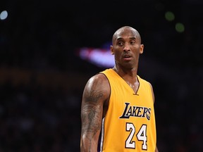 Kobe Bryant of the Los Angeles Lakers looks on during the Lakers' NBA match up with the Toronto Raptors at the Staples Center in Los Angeles on Nov. 20, 2015.
