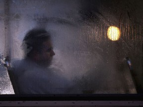 GLASGOW, UNITED KINGDOM - OCTOBER 10: A man makes his way home from work on a bus as darkness falls on October 10, 2005 in Glasgow, Scotland. Seasonal affective disorder (SAD), or winter depression, is a mood disorder related to the change in the seasons and the resulting reduction of exposure to daylight. The end of British Summer time, when clocks go back one hour at the end of October, will see most people making their daily commute in darkness both ways. With winter nights stretching to 19 hours in the UK, and Scotland's often inclement weather, it is estimated that the "Winter Blues" can affect up to 20% of the population.