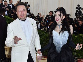 Elon Musk and Grimes arrive for the 2018 Met Gala on May 7, 2018, at the Metropolitan Museum of Art in New York.