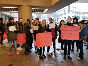 Protestors stand outside a Vancouver courtroom on January 20, 2020, pressing for the release of a senior Chinese telecommunications executive fighting extradition to the United States, were paid actors, they told local media. It was not clear, however, who footed the bill.