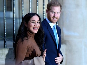 Britain's Prince Harry and his wife Meghan, Duchess of Sussex react as they leave after their visit to Canada House in London, Britain January 7, 2020.
