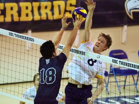 Jordan Deshane makes a block for the  UBC Thunderbirds against the Mount Royal University Cougars during U Sports Canada West action at UBC.