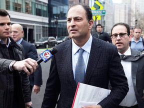 Vancouver businessman David Sidoo leaves a federal court hearing in Boston, March 15, 2019.