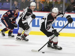 Kaden Kohle, right, of the Vancouver Giants has shown a willingness in his eight-game stint with Vancouver to forecheck with fervour, to throw his 6-3, 200-pound frame around to separate opponents from the puck.