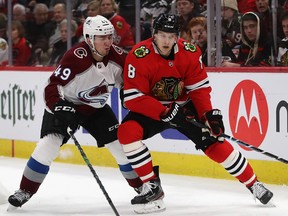Chicago Blackhawks Dominik Kubalik, right, and Samuel Girard of the Colorado Avalanche chase the puck at the United Center on Dec. 18, 2019 in Chicago, Ill. (Jonathan Daniel/Getty Images)