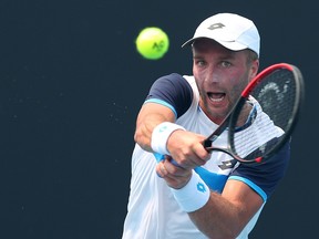 Liam Broady of Great Britain plays a backhand in his match against Ilya Ivashka of Belarus during 2020 Australian Open Qualifying at Melbourne Park on Jan. 14, 2020 in Melbourne, Australia. (Graham Denholm/Getty Images)