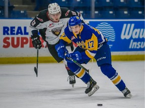 The Vancouver Giants, who have been pursuing Saskatoon Blades forward Eric Florchuk, right, on and off the ice, landed the talented WHL player in a Thursday trade.