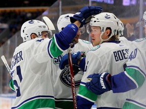 Jan 11, 2020; Buffalo, New York, USA;  Vancouver Canucks right wing Brock Boeser (6) celebrates his goal with teammates during the third period against the Buffalo Sabres at KeyBank Center. Mandatory Credit: Timothy T. Ludwig-USA TODAY Sports