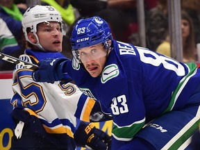 Jay Beagle leans on Colton Parayko during Monday's matchup at Rogers Arena.