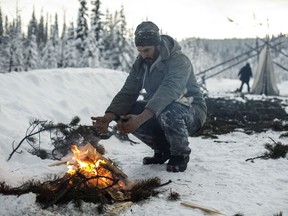 Cody Merriman a supporter of the Wet'suwet'en hereditary chiefs and who opposes the Coastal GasLink pipeline helps to build a support station at kilometre 39 near the Gidimt'en checkpoint near Houston B.C., on Wednesday January 8, 2020. The Wet'suwet'en peoples are occupying their land and trying to prevent a pipeline from going through it.