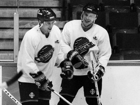 Russians Igor Larionov and Pavel Bure, pictured during a February 1992 Canucks practice, were only teammates for one season — Bure’s rookie campaign, for which he won the 1991-92 Calder Trophy as the NHL’s top freshman.