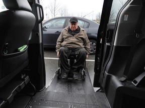 Vince Miele with his vehicle, which is modified for wheelchair access.