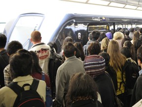 Commuters line up at Broadway Skytrain.