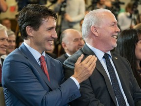 Prime Minster Justin Trudeau, left, and Premier John Horgan were all smiles in October 2018 at the announcement of the signing of an investment decision for an LNG project in Kitimat.