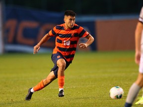 Vancouver Whitecaps midfielder Ryan Raposo takes on New Hampshire while playing for the Syracuse Orangemen last season.