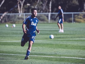 Ryan Raposo runs through drills at Vancouver Whitecaps training camp in San Diego on Friday. The Hamilton, Ont., native, taken fourth overall in the MLS SuperDraft has been turning heads at practice.  [PNG Merlin Archive]
