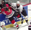 Chicago Blackhawk Craig Mills gets checked by Bret Hedican in 1997.