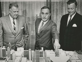 Left to right: Toronto Maple Leafs owners Harold Ballard and Stafford Smythe show the design of their proposed downtown hockey arena to the Vancouver media on Aug. 19, 1964. Vancouver Mayor Bill Rathie (right) supported the plan, which would have seen a 20,000 arena built on West Georgia where the CBC and Vancouver Public Library are today. Vancouver council offered Ballard and Smythe a 99 year lease on the property, but the Leafs owners rejected it because they wanted the land outright. A plebiscite was held on whether to give Smythe and Ballard the property, and voters rejected it on Dec. 9, 1964. Deni Eagland/Vancouver Sun