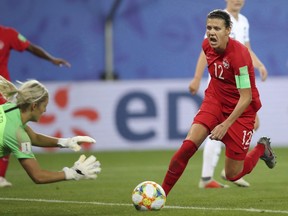 Canada's Christine Sinclair, right, tries a shoot during the Women's World Cup Group E soccer match between Canada and New Zealand in Grenoble, France, Saturday, June 15, 2019.