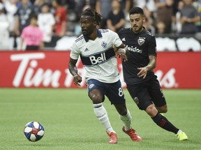 Vancouver Whitecaps forward Tosaint Ricketts, left, controls the ball against DC United midfielder Junior Moreno during MLS action last year at B.C. Place Stadium.