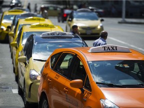 Taxi cabs line up near Canada Place.