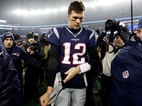 New England Patriots quarterback Tom Brady (12) walks off of the field after a loss to the Tennessee Titans at Gillette Stadium.