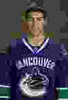 Luc Bourdon poses for his 2007 NHL headshot during Vancouver Canucks photo day in 2007.