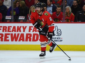 Chicago Blackhawks defenceman Duncan Keith skates the puck up ice during a game against the visiting San Jose Sharks in October 2019.