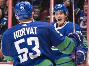 Loui Eriksson of the Vancouver Canucks celebrates with teammate Bo Horvat after scoring against the Boston Bruins during NHL action at Rogers Arena on Feb. 22 in Vancouver.