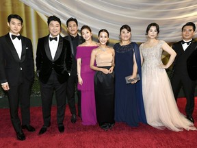 The main cast of Oscar-winning best film Parasite — Choi Woo-shik, Kang-Ho Song, Lee Sun Gyun, Park So-dam, Cho Yeo-jeong, Lee Jeong-eun, Jang Hye-jin and Park Myung-hoon (left to right) —at the 92nd annual Academy Awards in Hollywood, Calif., on Feb. 9, 2020.