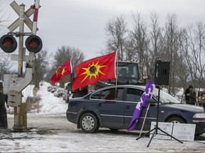 Mohawk Warrior flags were on display at an anti-pipeline protest at Wyman Rd., east of Belleville, on Feb. 11, 2020. (Ernest Doroszuk, Toronto Sun)