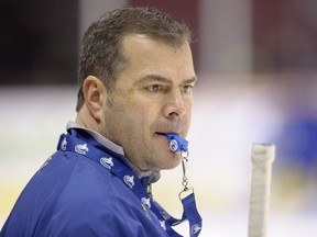 Alain Vigneault watch his Vancouver Canucks practice on Jan. 15, 2013.