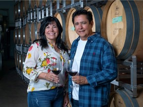 Robert and Bernice Louie in the Indigenous World Winery barrel room in West Kelowna.