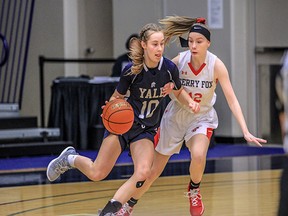 Kyleigh Boldt of the Yale Lions tries to elude Terry Fox Ravens defender Taylor Matthews in Friday's semifinal game at the Langley Events Centre.