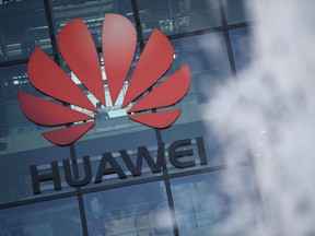 The logo of Chinese company Huawei is seen at their main U.K. offices in Reading, west of London. The U.S. has added charges of trade secret theft to its case against the smartphone giant.