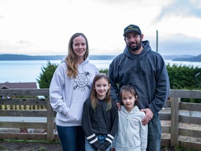 Natasha and Chad Woo, with their daughters Peyton, 8, and Brianna, 6, at their home in Hyde Creek, near Port McNeill.