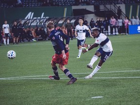 Vancouver Whitecaps winger Cristian Dajome takes a shot against the New England Revolution on Wednesday in Portland. He gets another shot to secure a starting spot come regular season when the Caps take on Minnesota in their final pre-season game on Saturday afternoon.