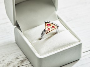 This pizza slice-shaped engagement ring by Domino's costs $9,000. (Twitter)